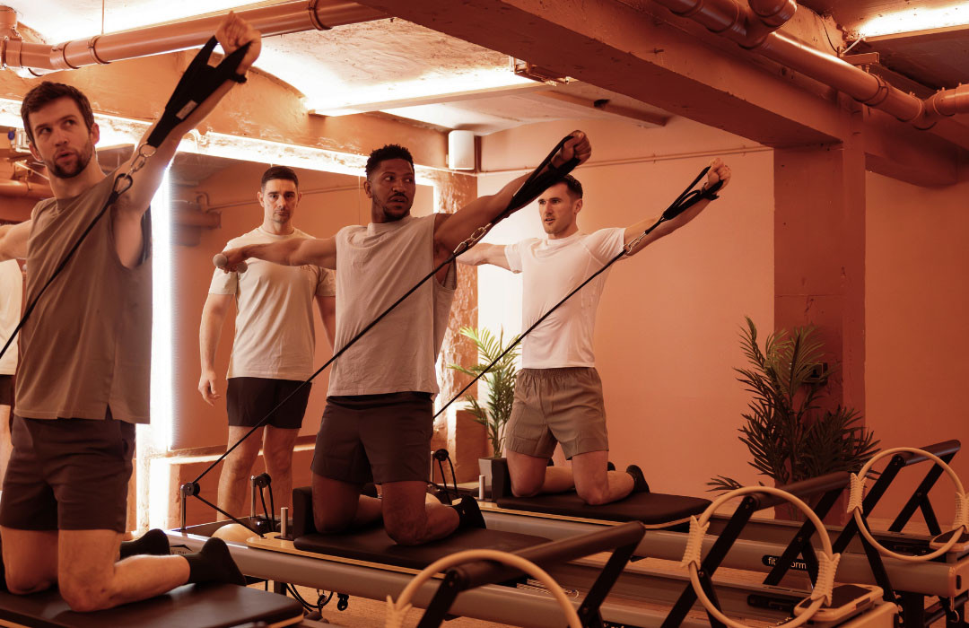 A group Reformer Pilates class in the Reformer studio at The Sanctuary in Shoreditch