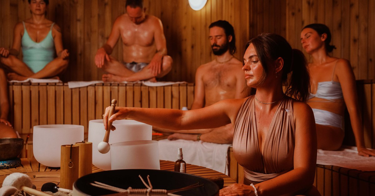 A sound bath with singing bowls inside the sauna at AndSoul Sanctuary, Shoreditch